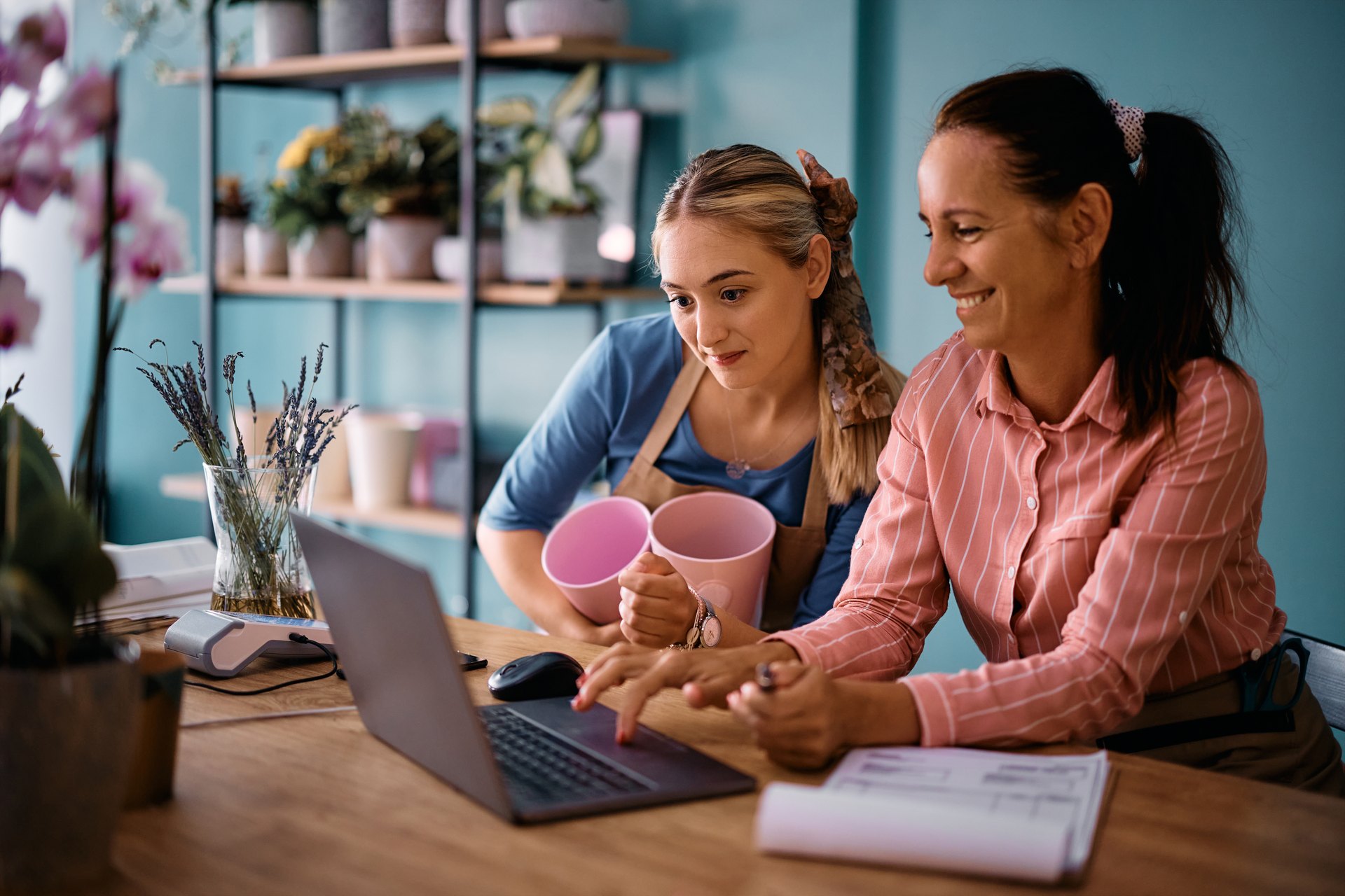 Small-business owners working together with a laptop