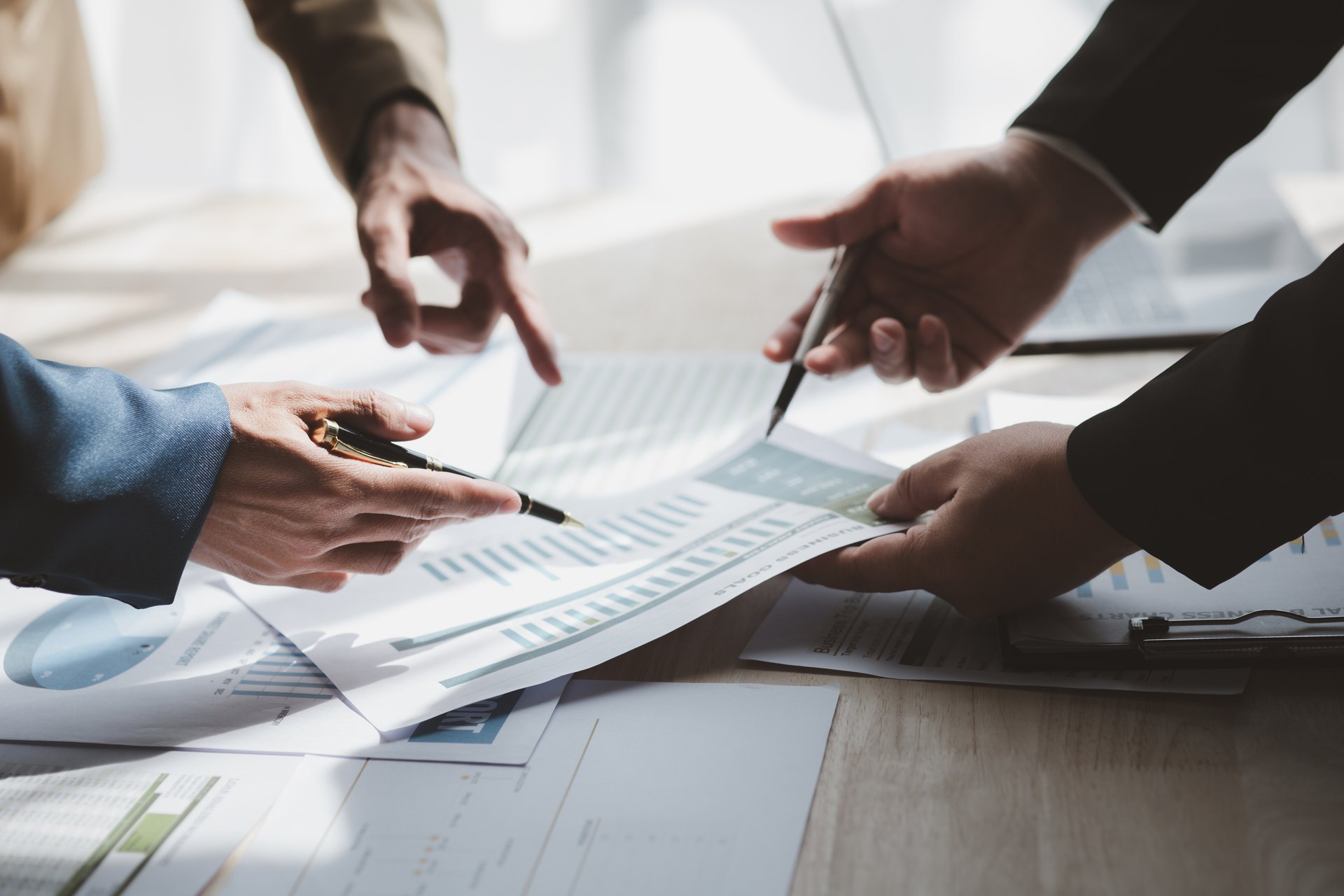 People reviewing printed documents together