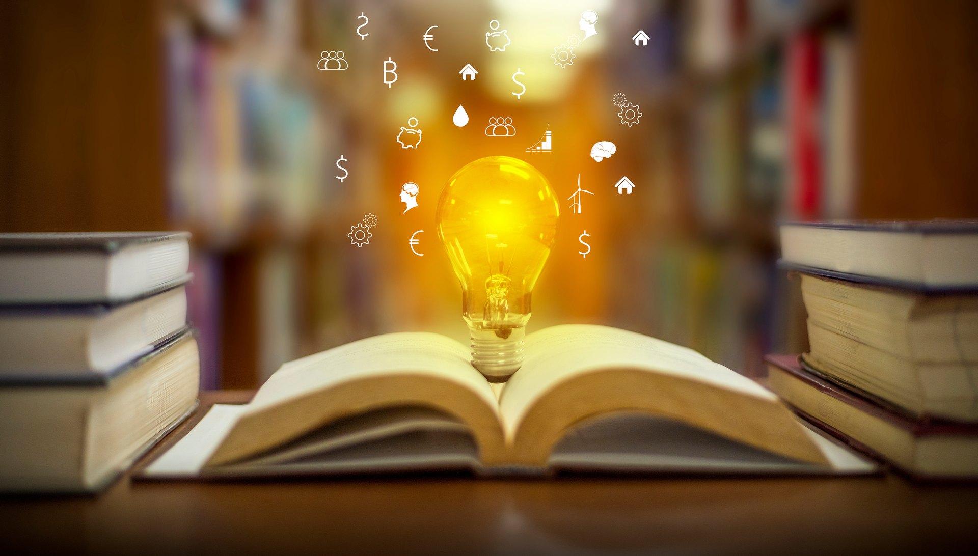 Open book with a glowing light-bulb illustration