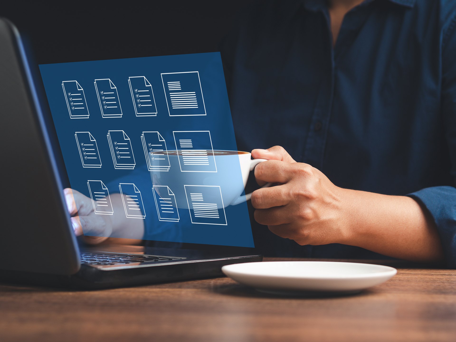 Person using a laptop with a conceptual document overlay