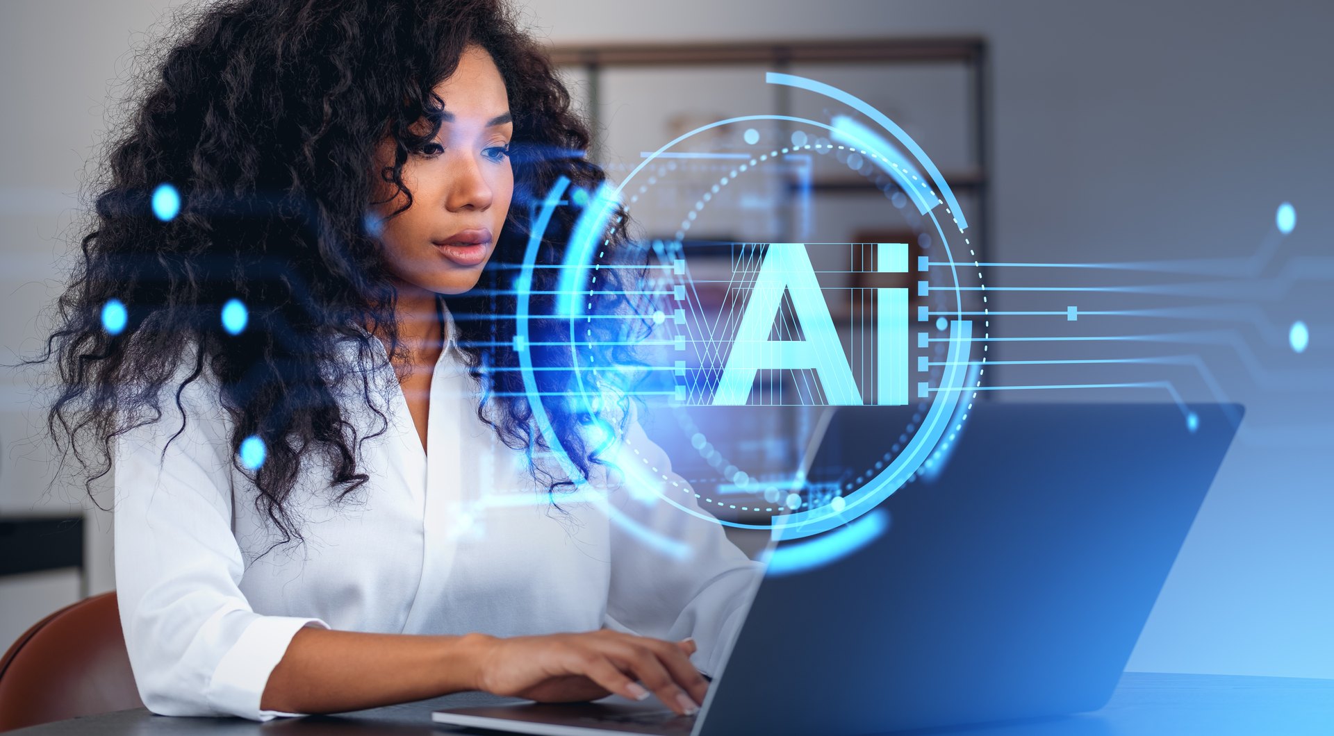 Person using a laptop with an AI illustration overlay