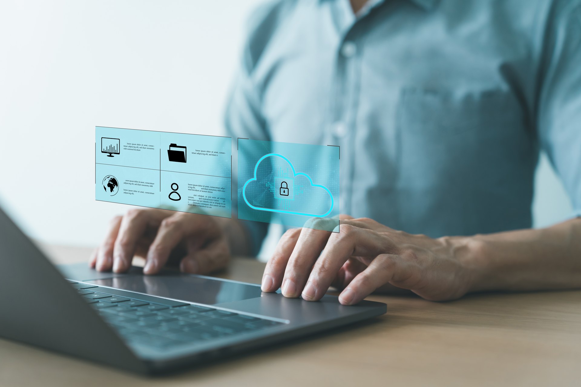 Person using a laptop with file and security symbols
