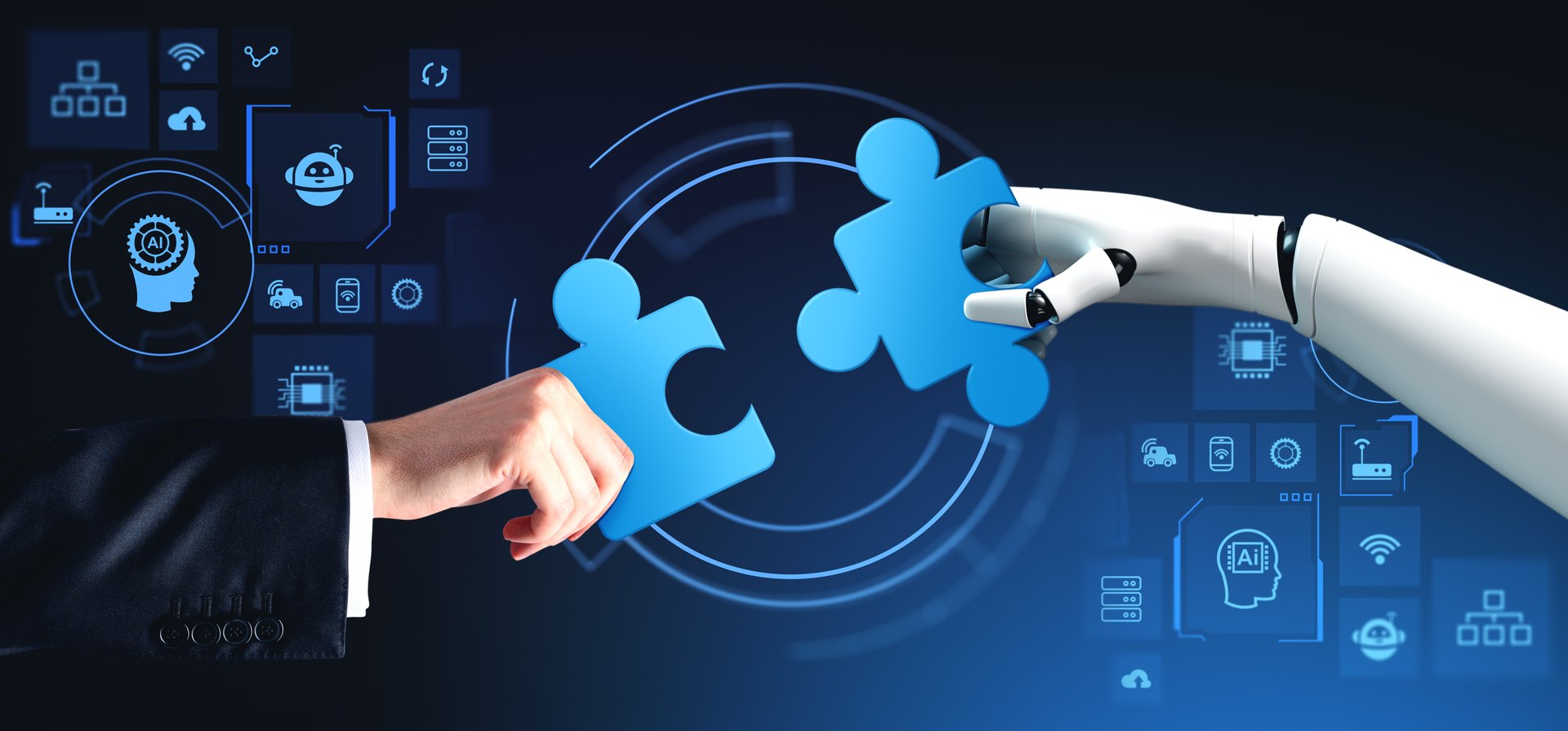 Human and robotic hands joining puzzle pieces